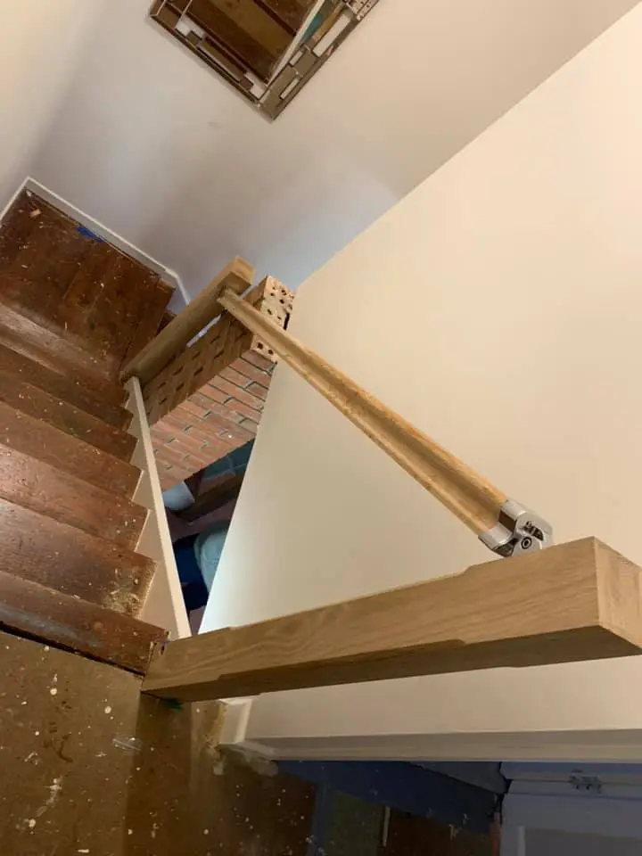 unfinished work being done to a wooden bannister