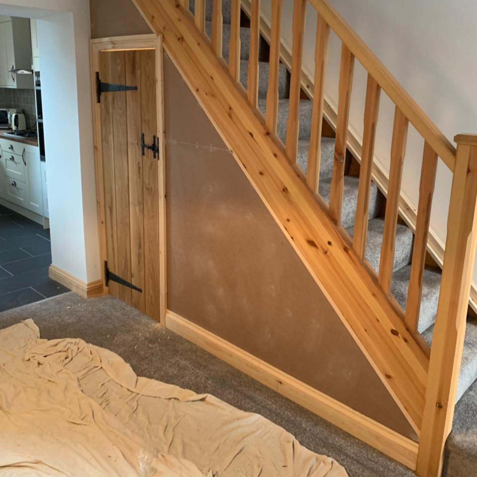 New wooden staircase with under stair storage cupboard