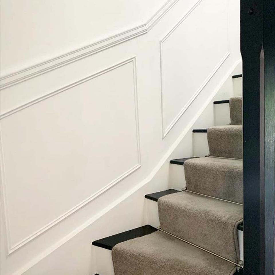 finished wooden paneling on a staircase